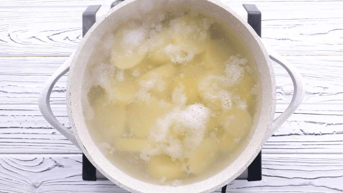 Boil potatoes until fork-tender.