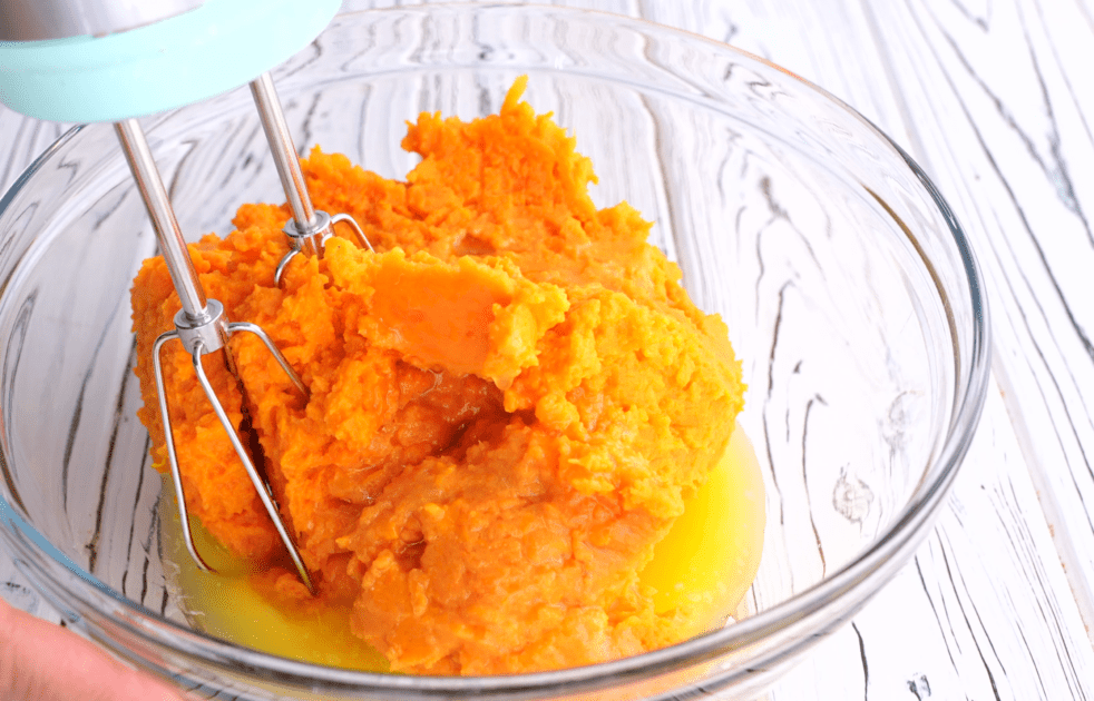 Mix together sweet potatoes and melted butter.