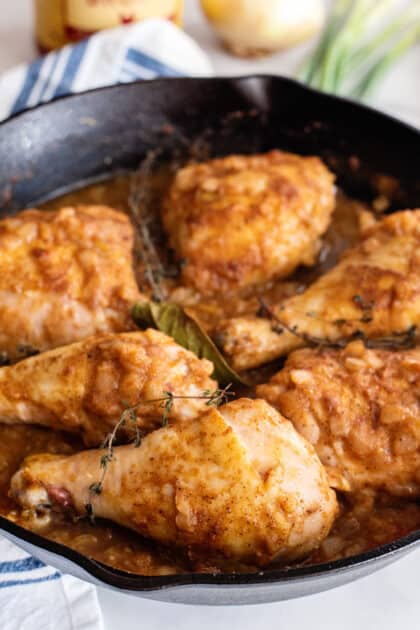 Add chicken back to skillet along with thyme and bay leaf.
