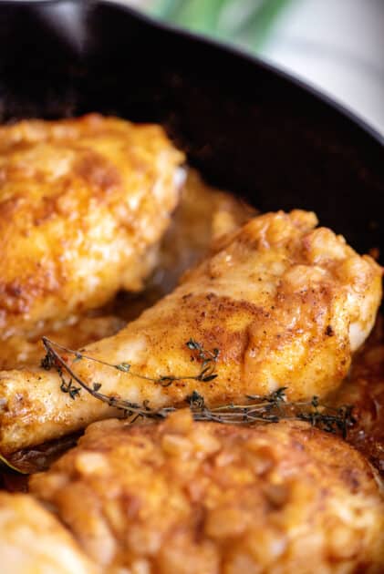 Southern smothered chicken in skillet.