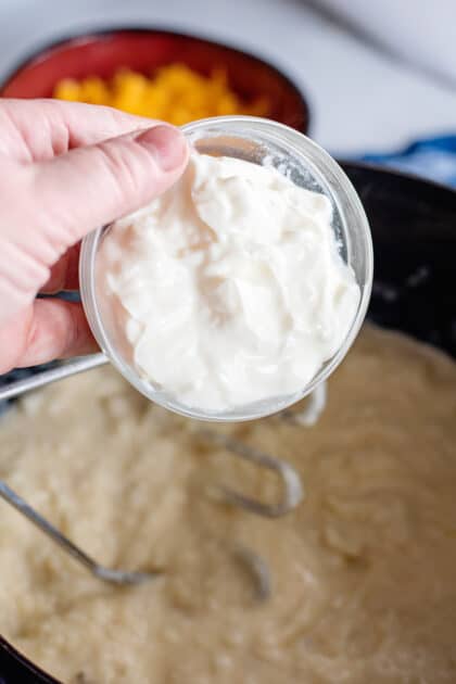 Stir sour cream into pot.