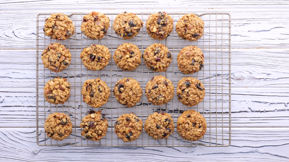 Baked oatmeal cranberry cookies on wire rack.