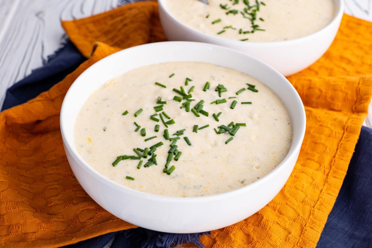 Serve she-crap soup with fresh chives on top.