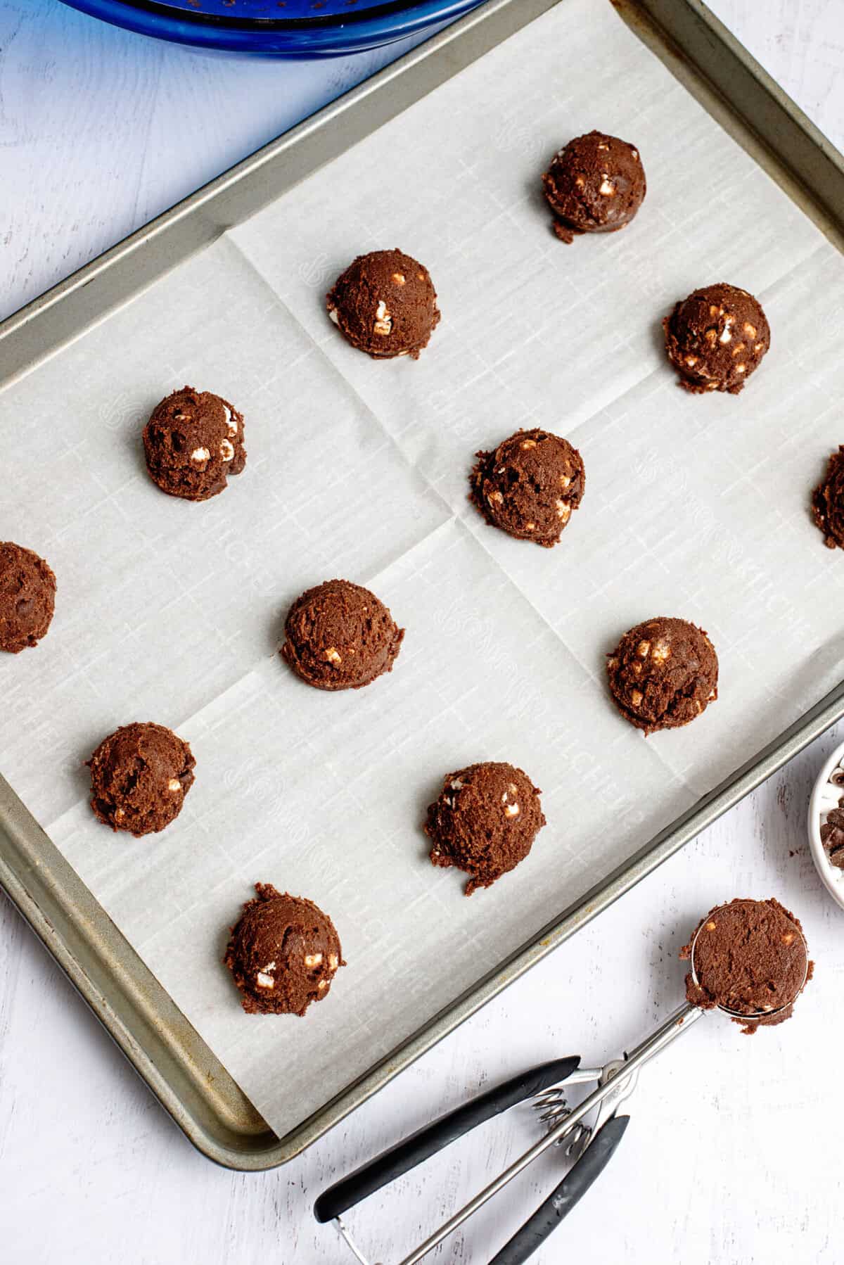 scoop cookies onto prepared sheet