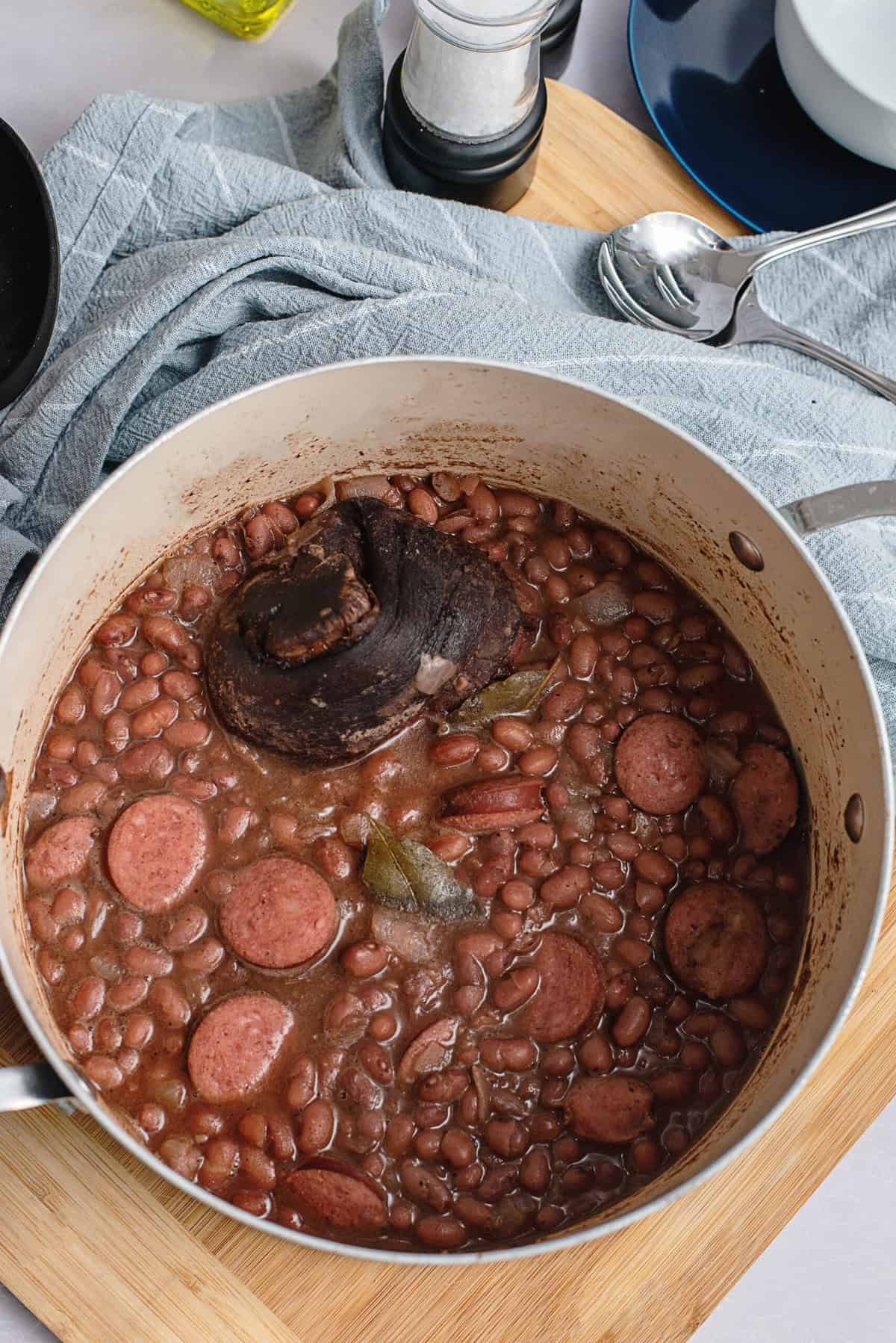 Add sausage slices to cooked beans