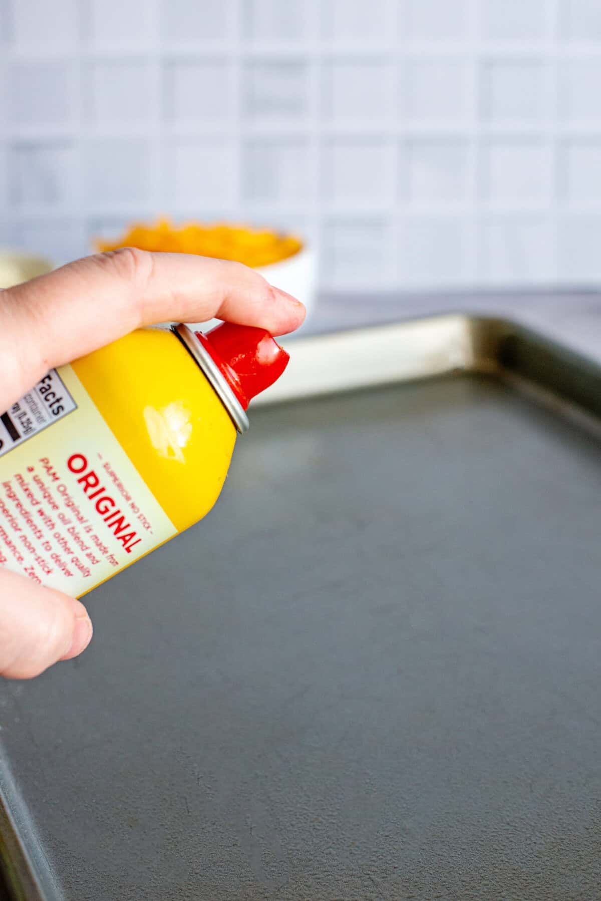 prepare a baking sheet with cooking spray