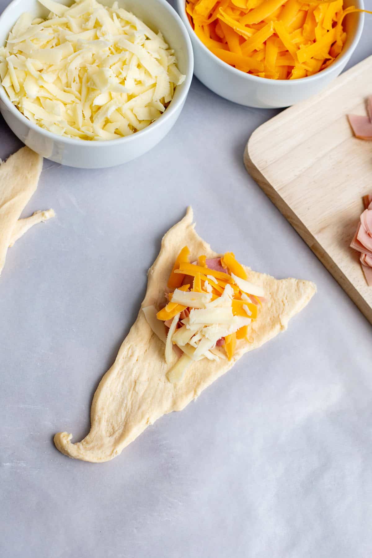 fill dough triangle with meet and cheese