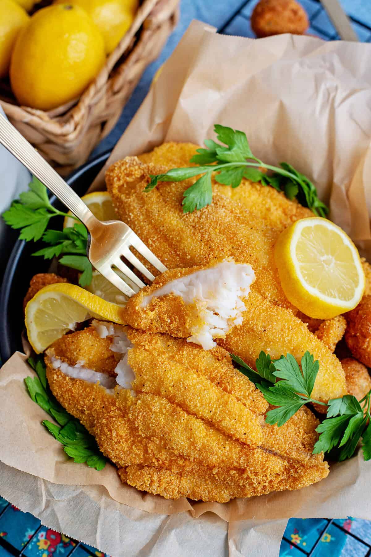 Dipping a fork into delicious Southern fried catfish.