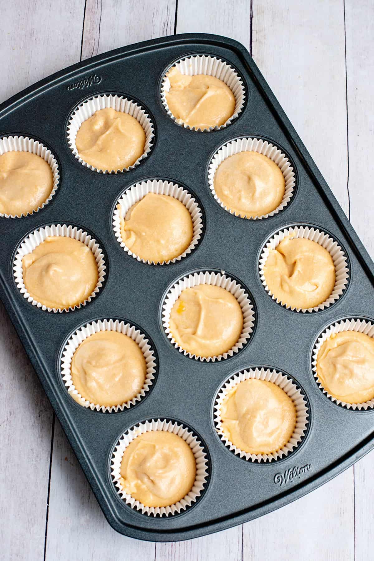 fill evenly with orange dreamsicle cupcake batter