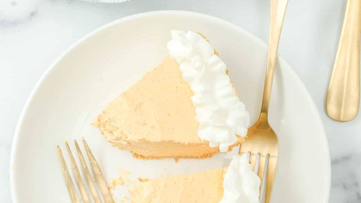 Two slices of no-bake pumpkin cheesecake on plate.