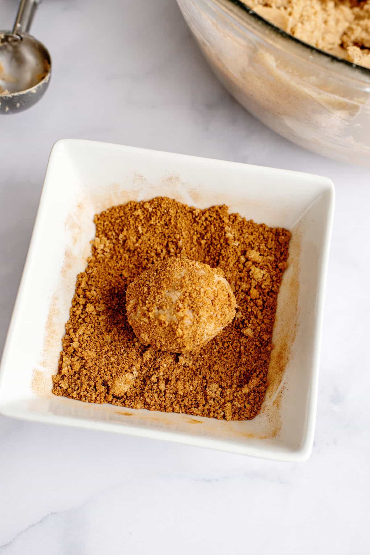 Roll Pumpkin Spice Snickerdoodle dough in coating