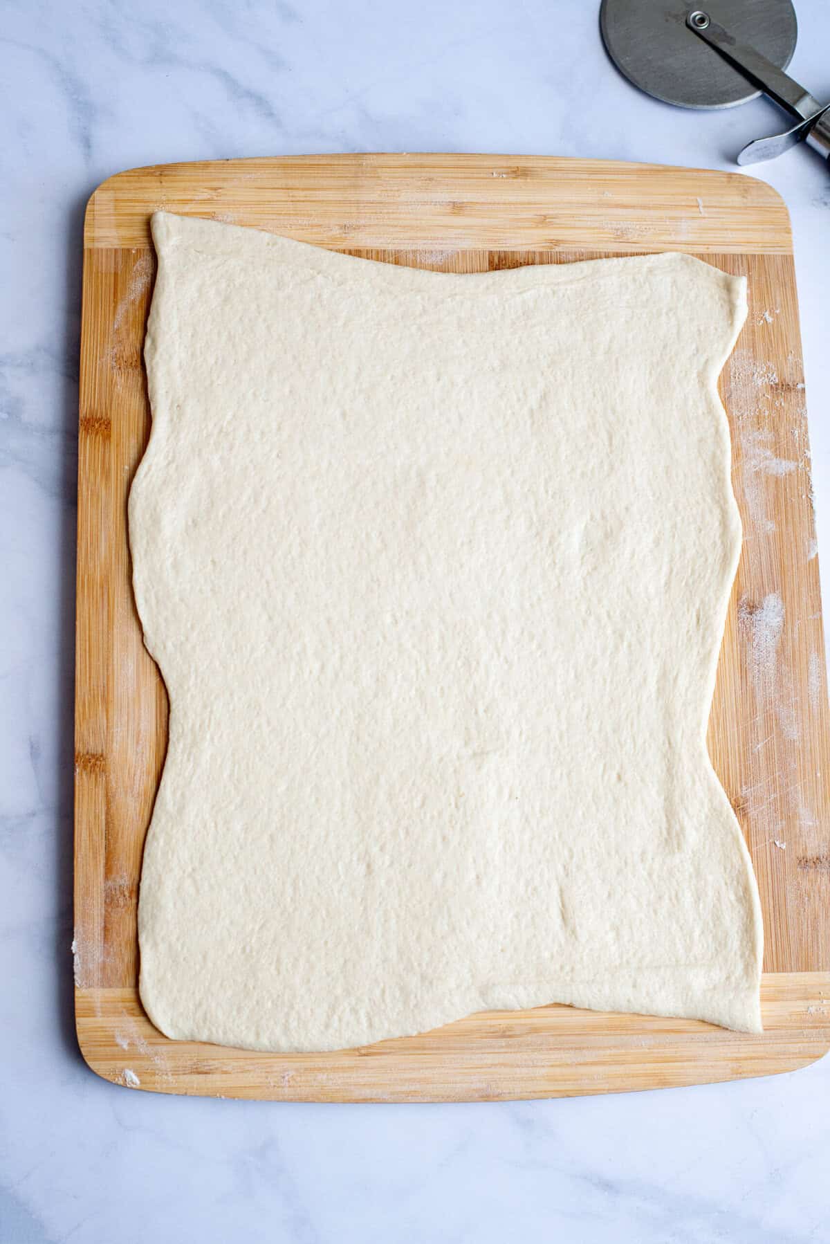 Roll out refrigerated pizza dough