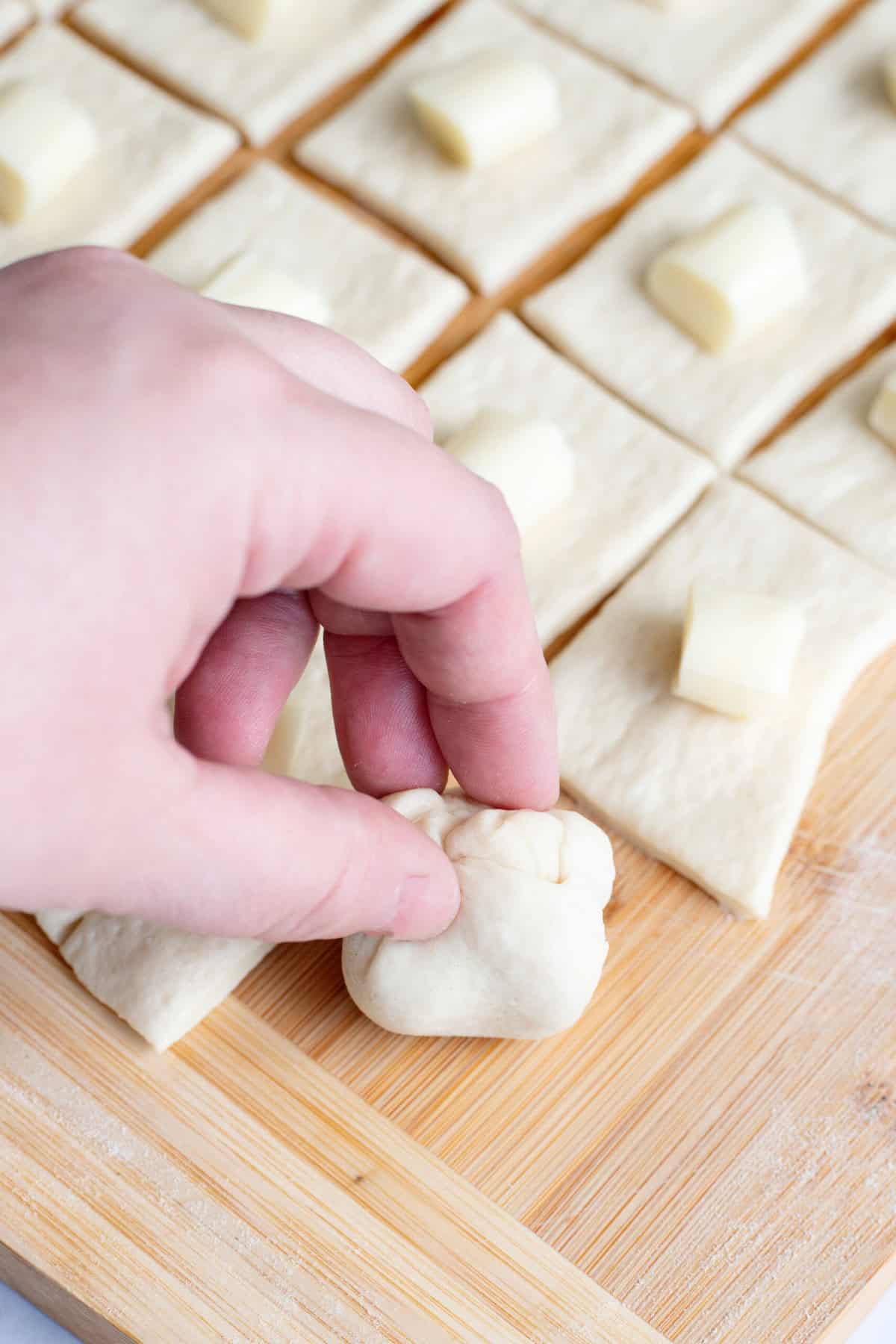 Pull edges of dough together to form a ball