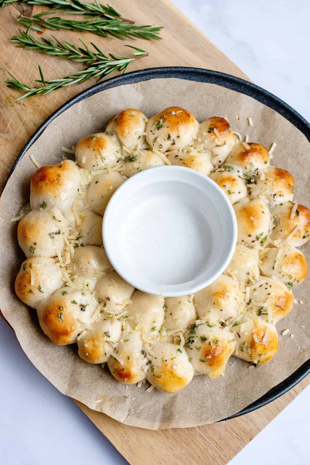 Sprinkle Cheesy Pull Apart Bread Christmas Wreath with parmesan cheese