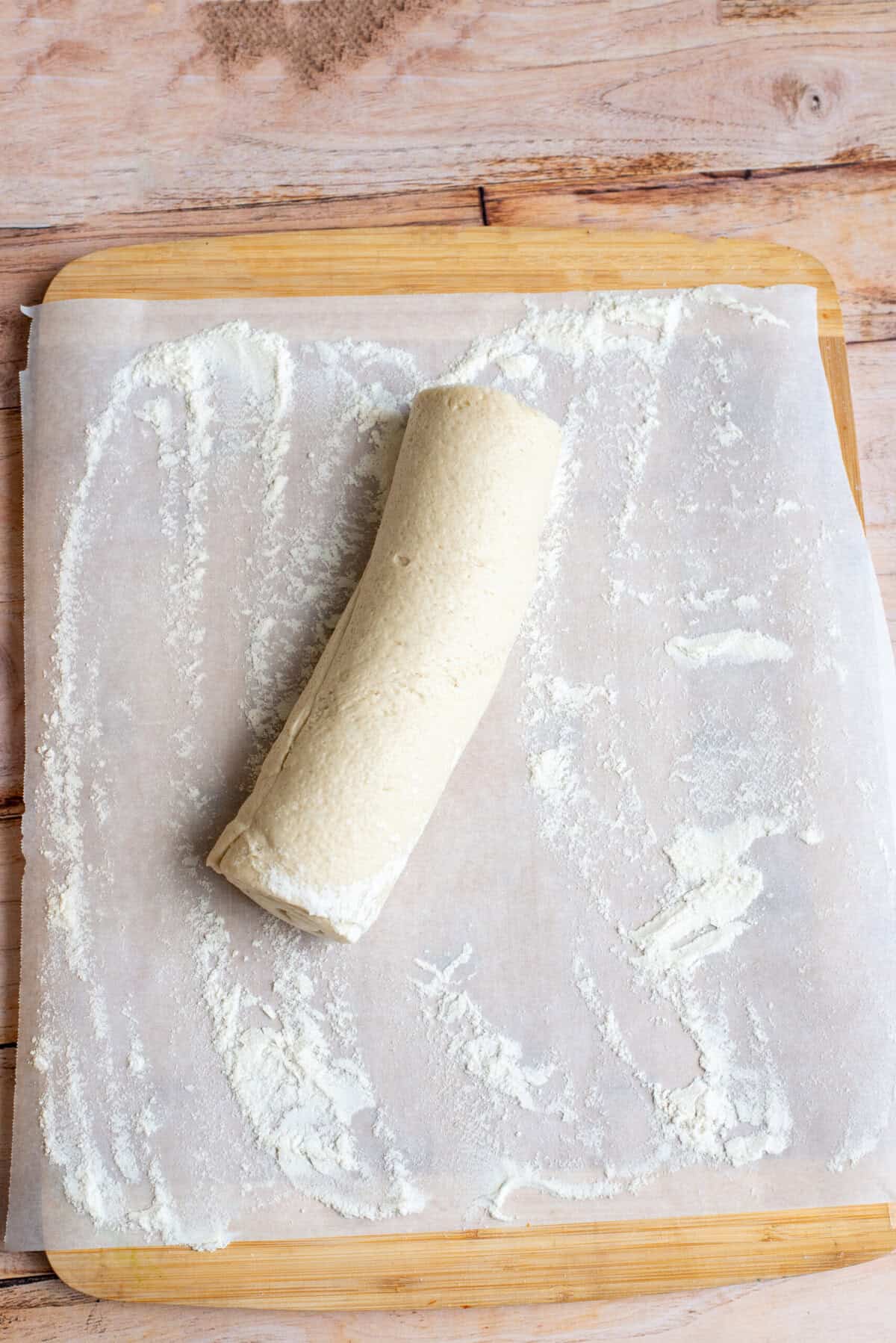 Flour surface and open the pizza crust roll