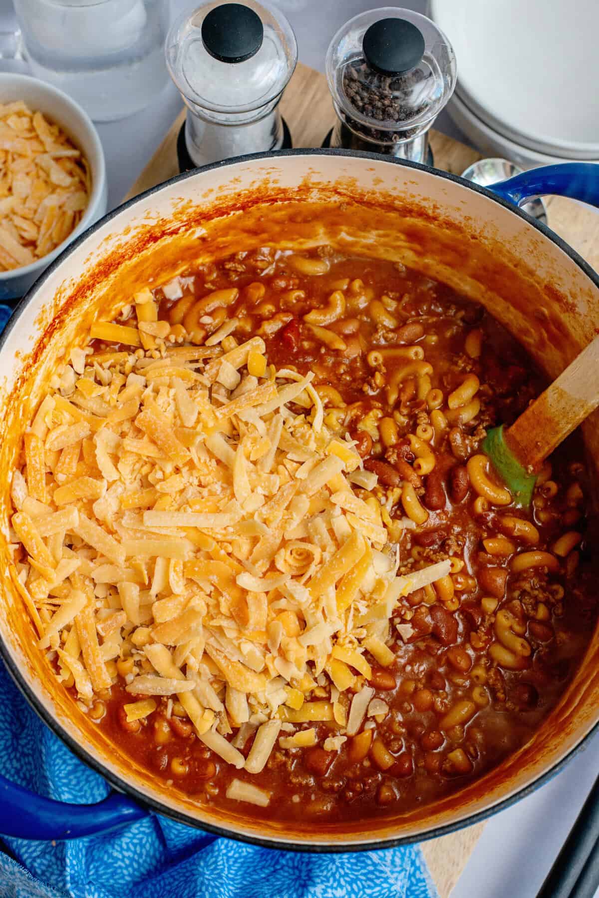 Add cheese to cooked beef and pasta mixture