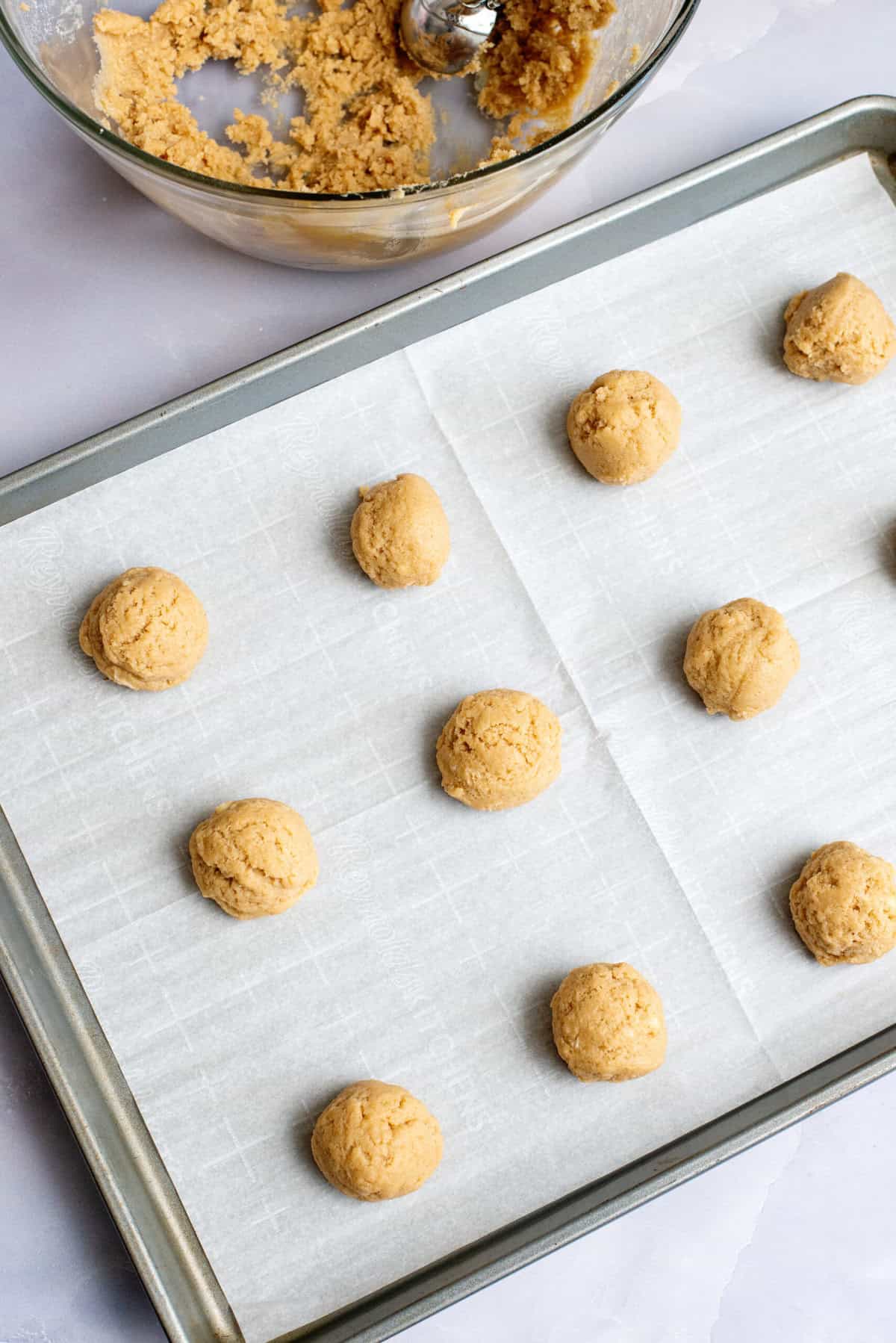 Use cookie scoop to portion Frosted Maple Cookie batter