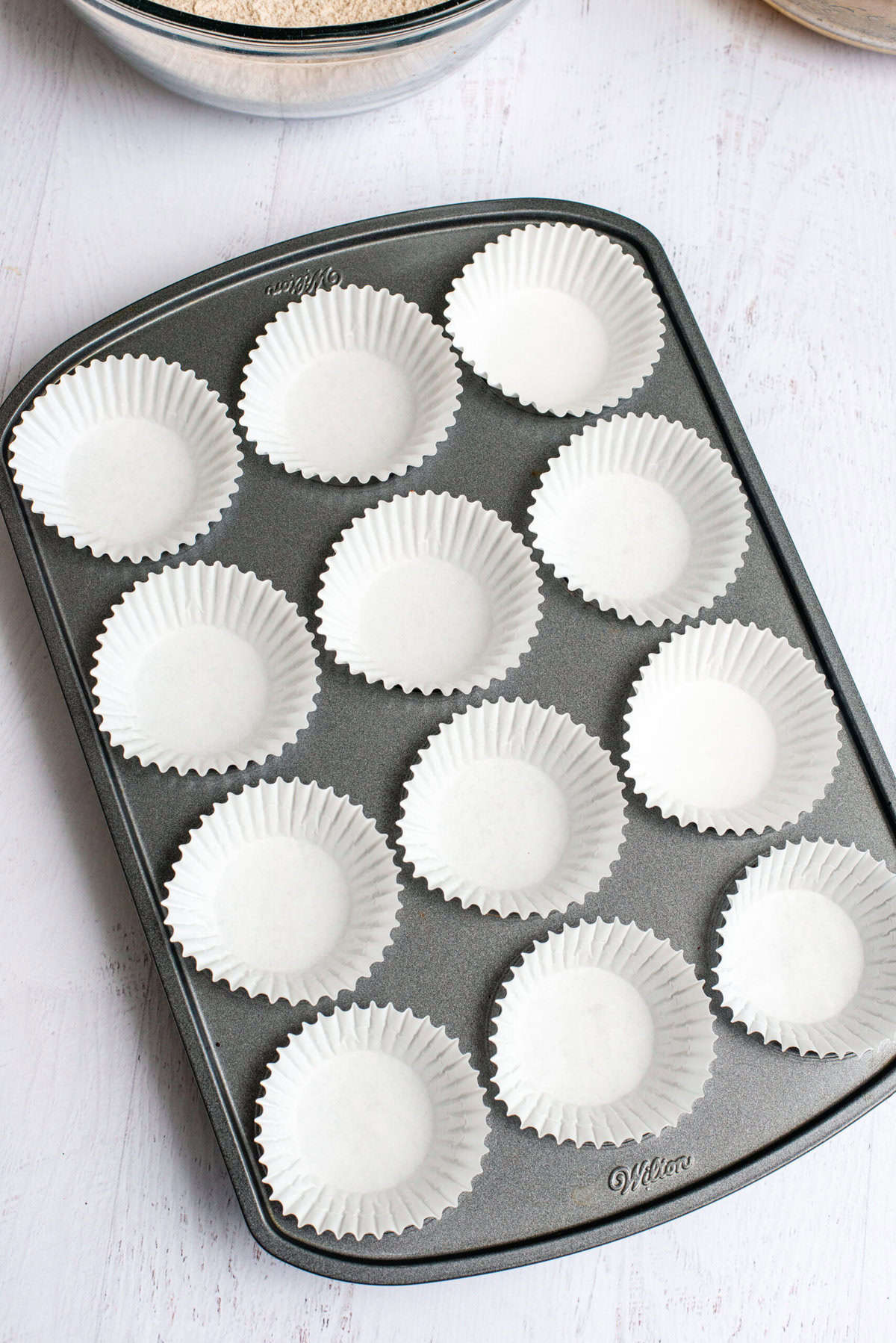 Place cupcake liners to pan