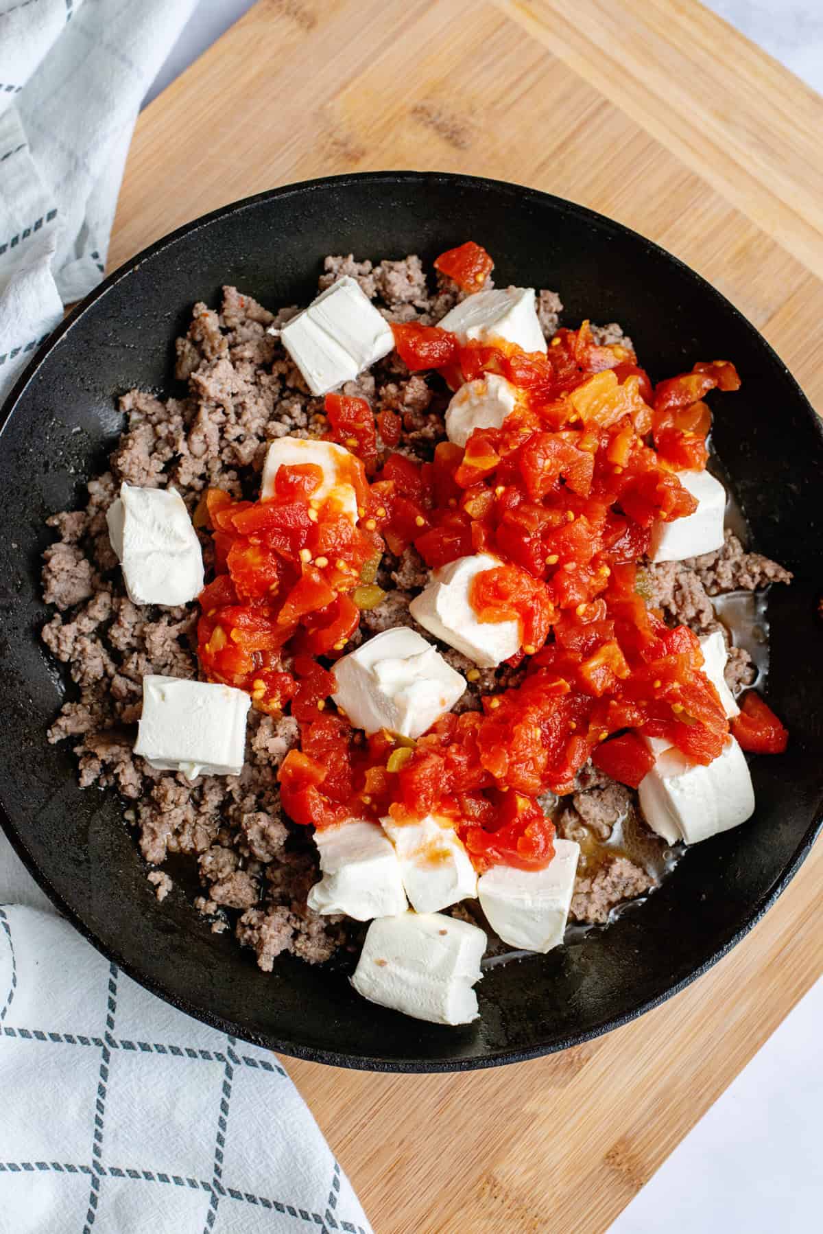 Stir Rotel and Cream Cheese into browned sausage