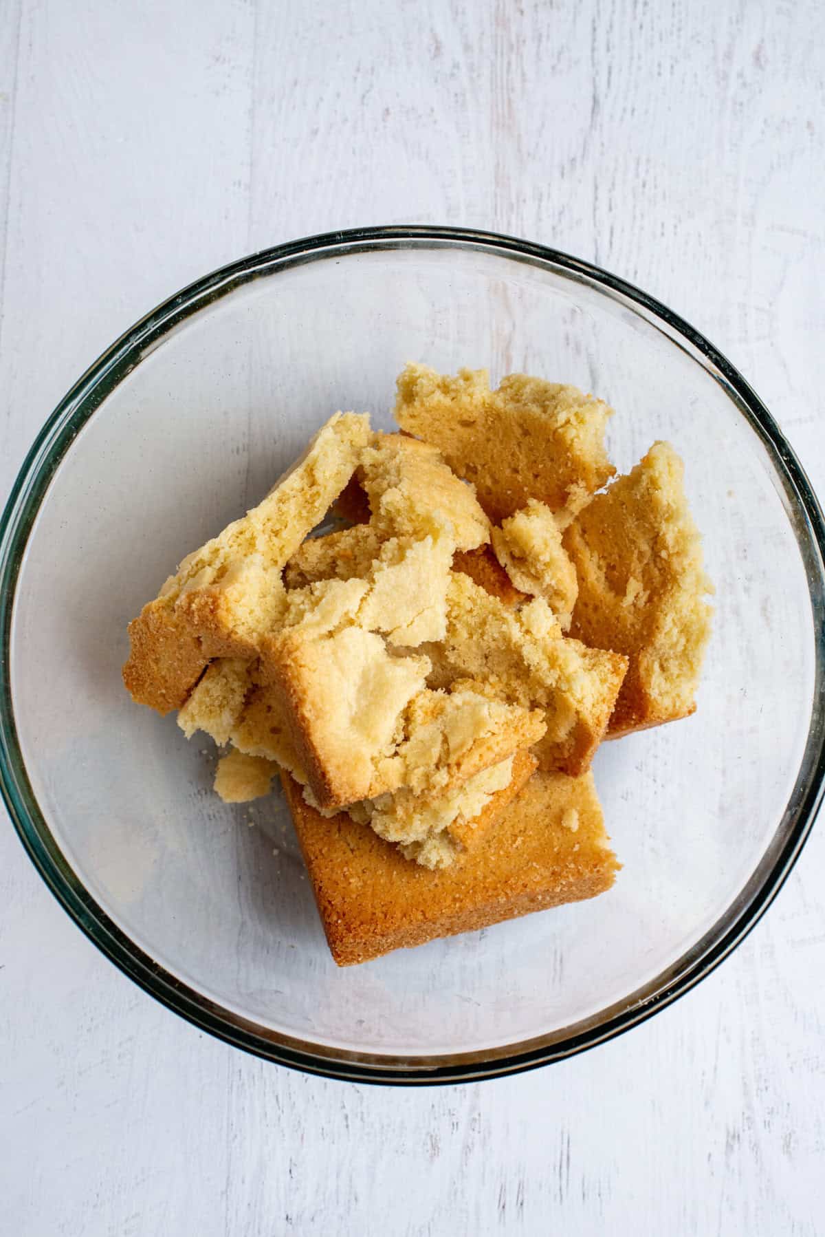 Crumble baked sugar cookie into a bowl