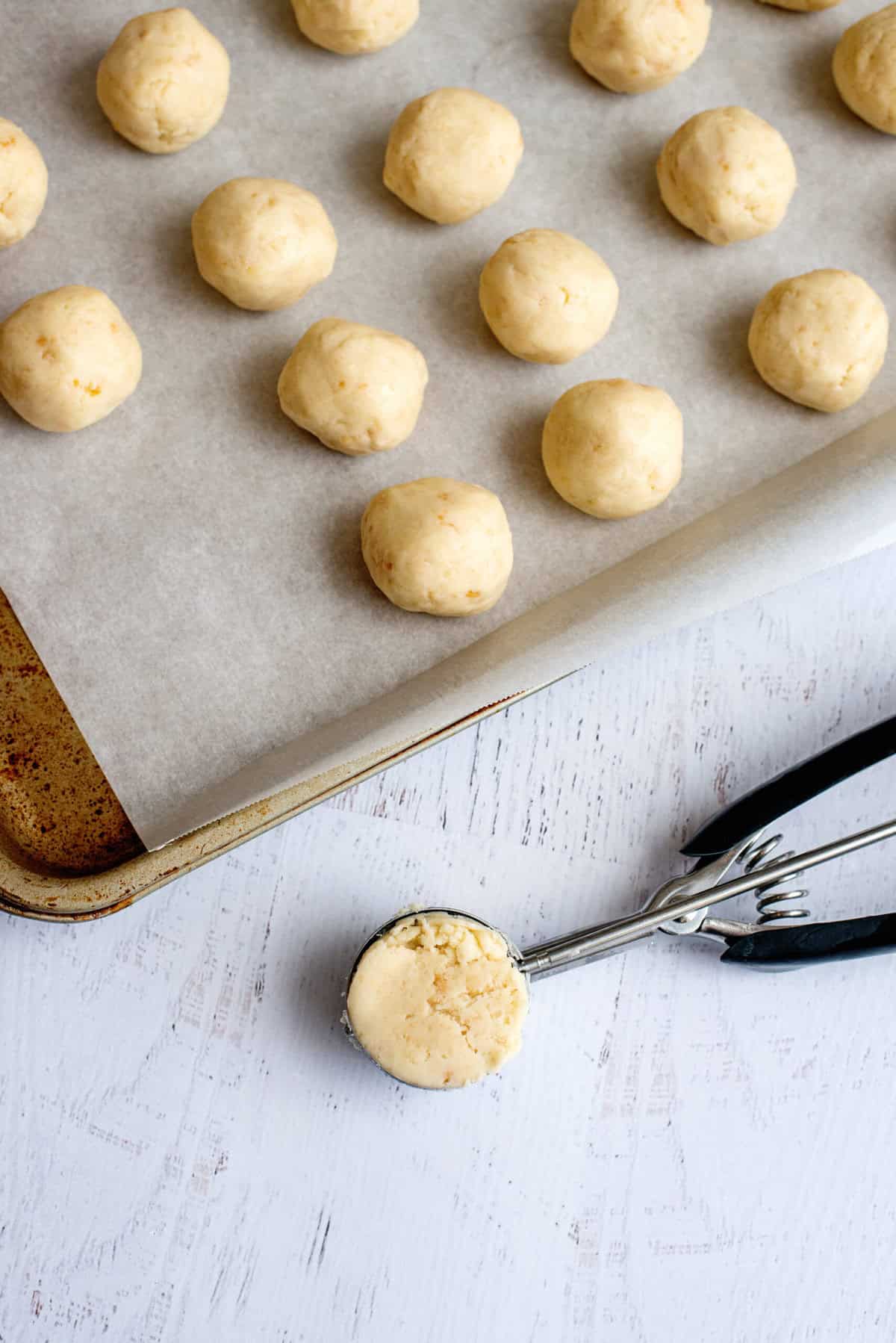 Scoop cake balls onto a baking sheet