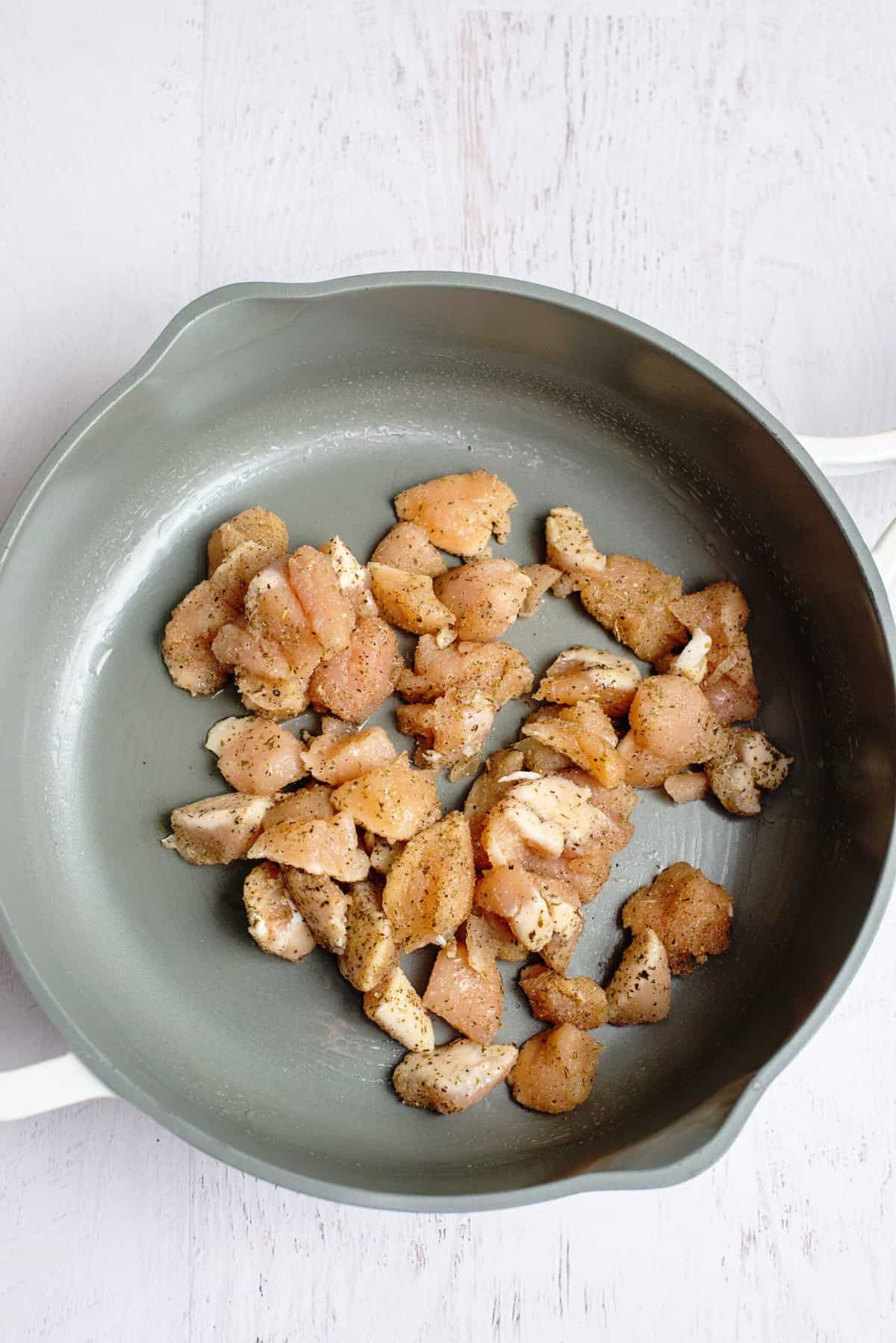 Cook cubed chicken in a skillet