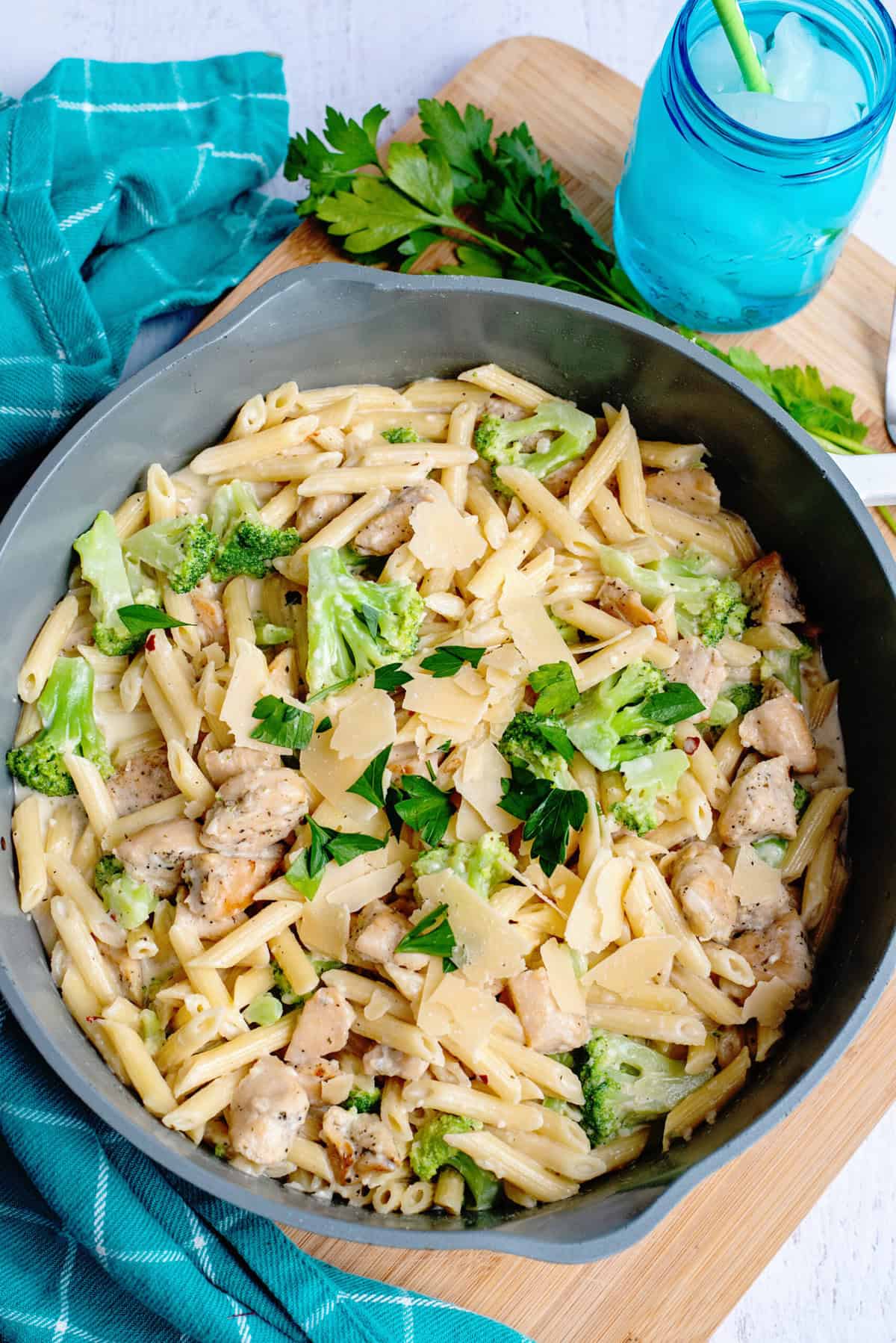 Garnish Garlic Parmesan Chicken Tenderloin and Broccoli Pasta with fresh parsley