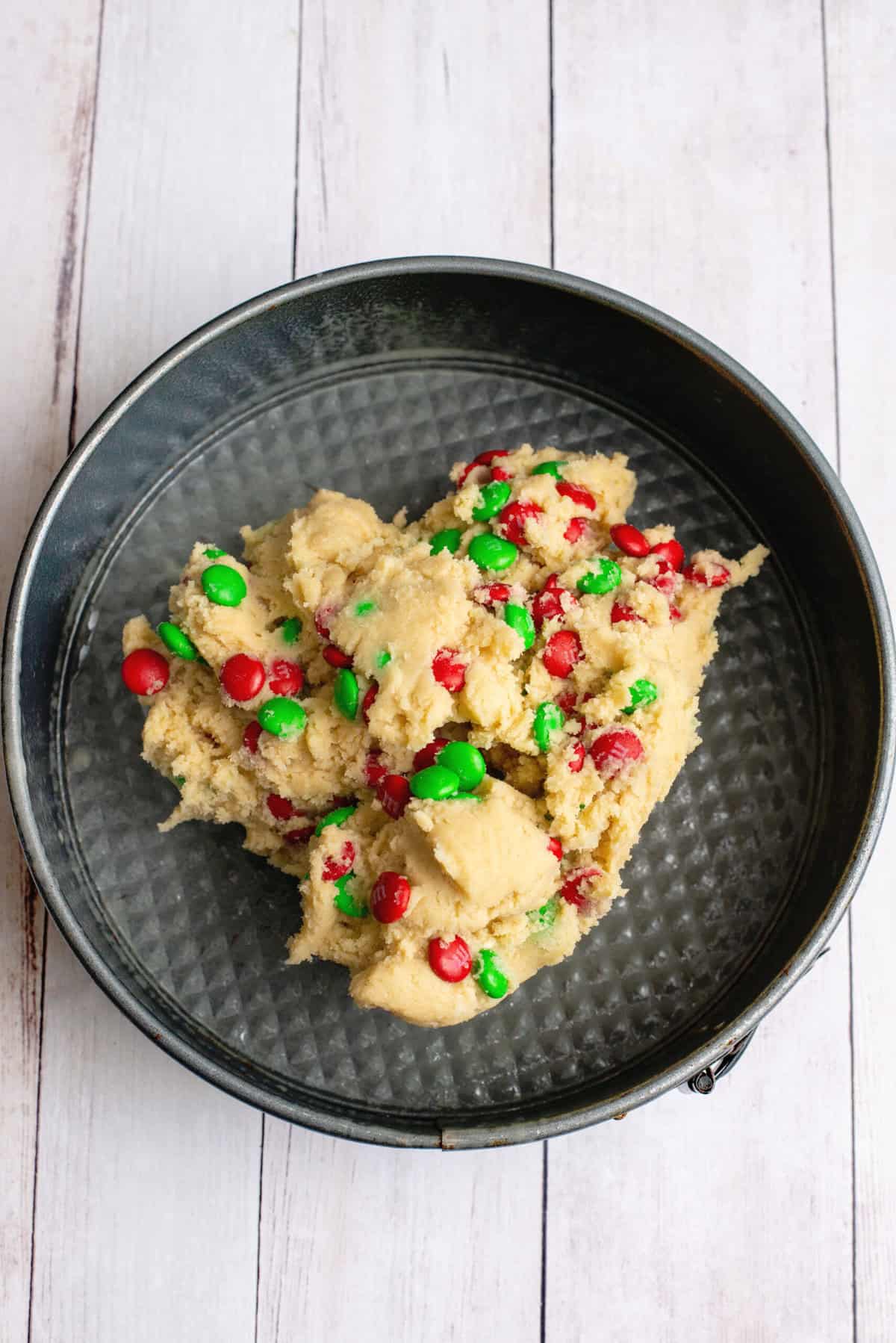 Press Christmas Sugar Cookie Cake batter into prepared pan.