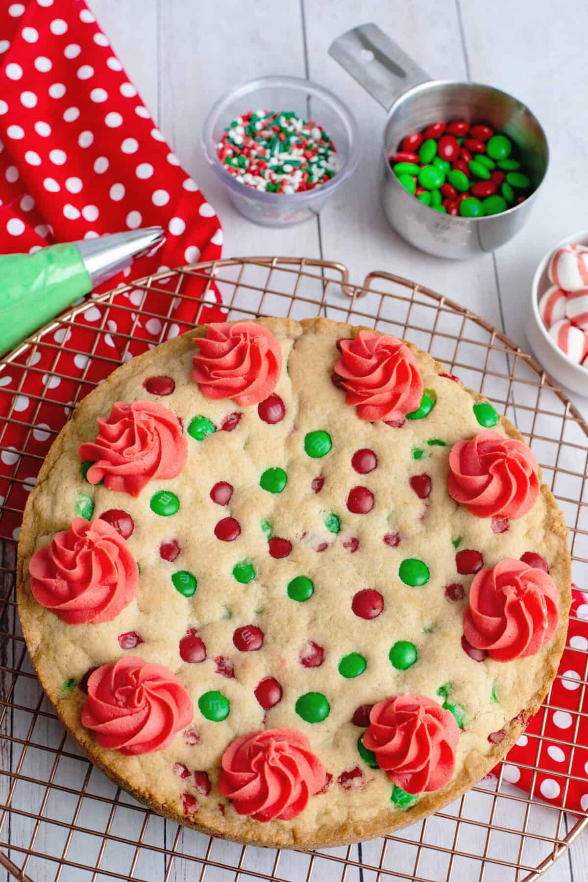 pipe red rosettes around Christmas Sugar Cookie Cake