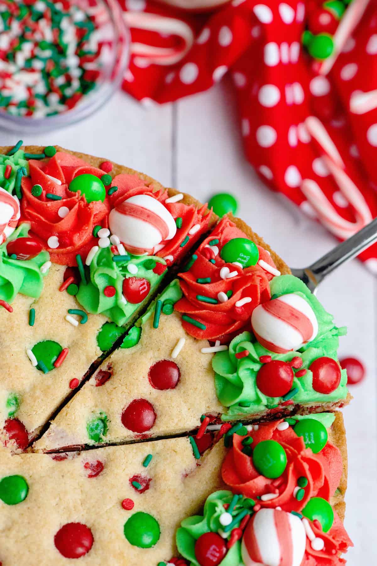 Cut Christmas Sugar Cookie Cake in slices to serve