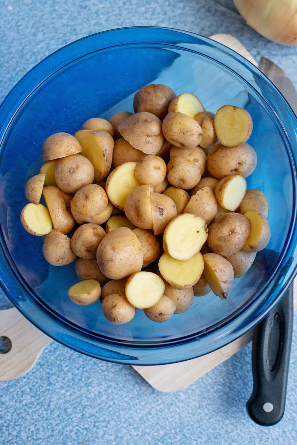 Cut little potatoes in half