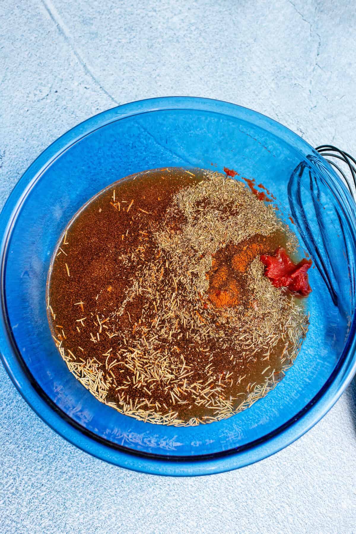 combine tomato paste, liquid sauces and spices in a small bowl