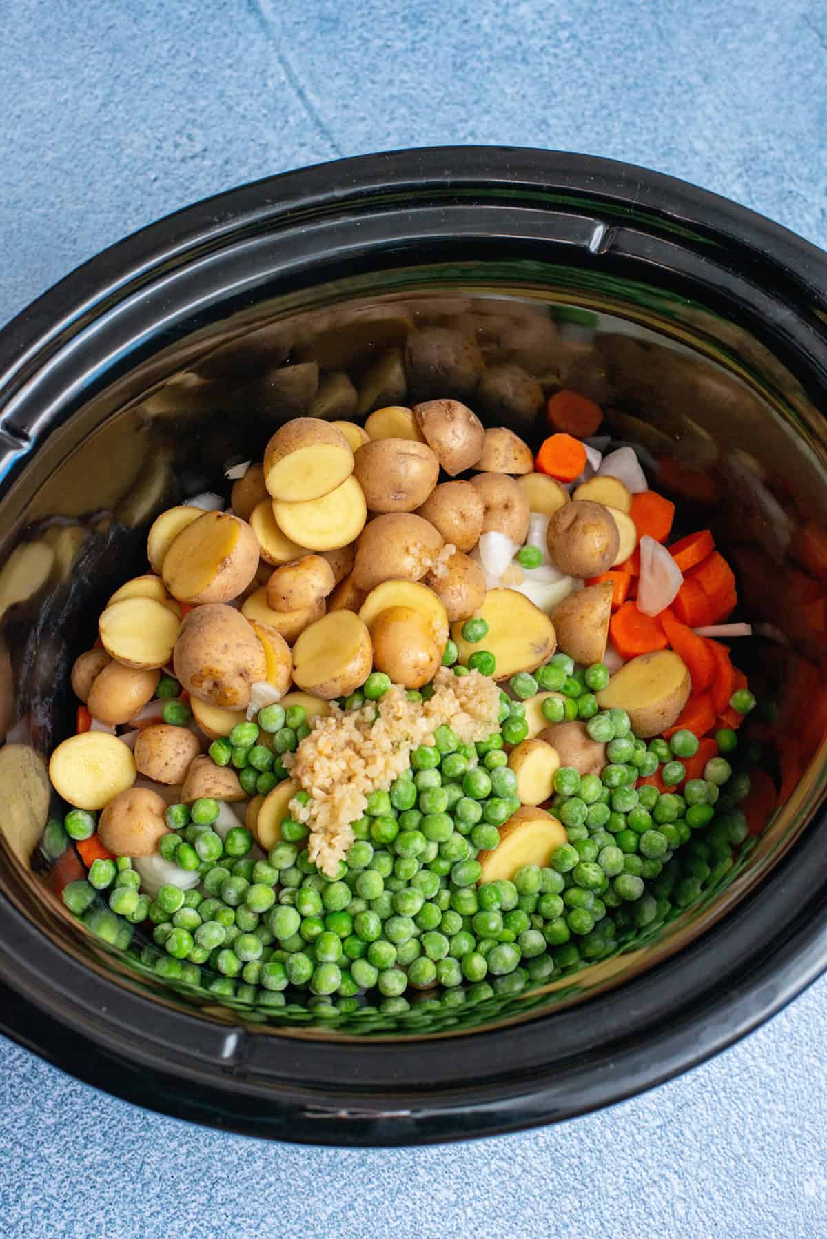 Put vegetables into crockpot