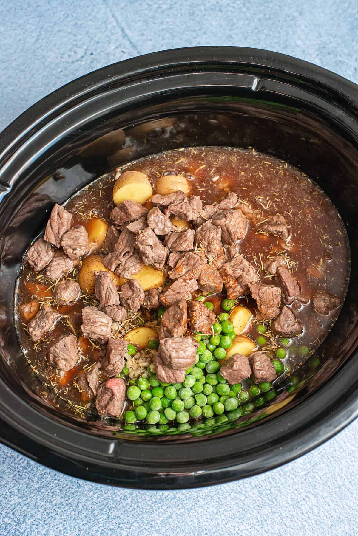 Pour liquid mixture over beef and vegetables