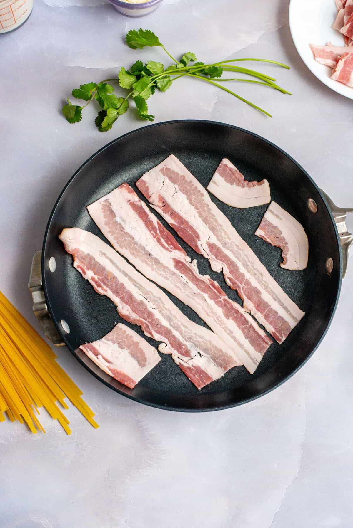 Fry bacon in a large skillet.