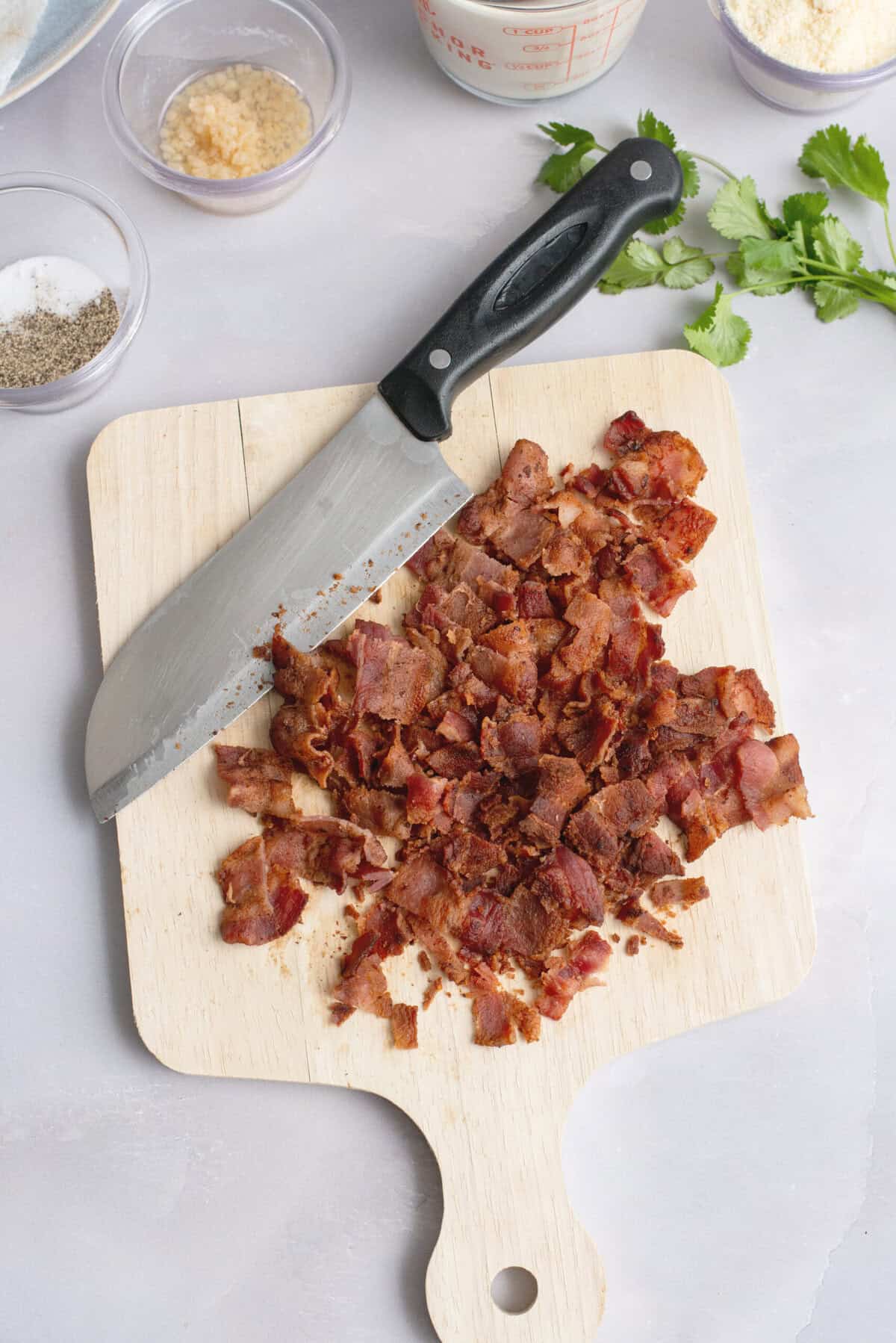 Chop cooled bacon.