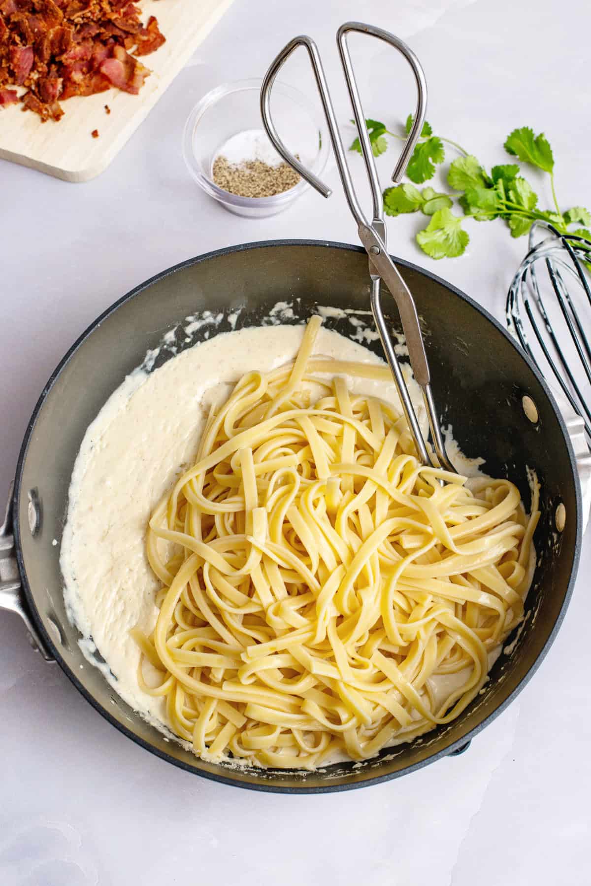 Add cooked pasta to cheese sauce