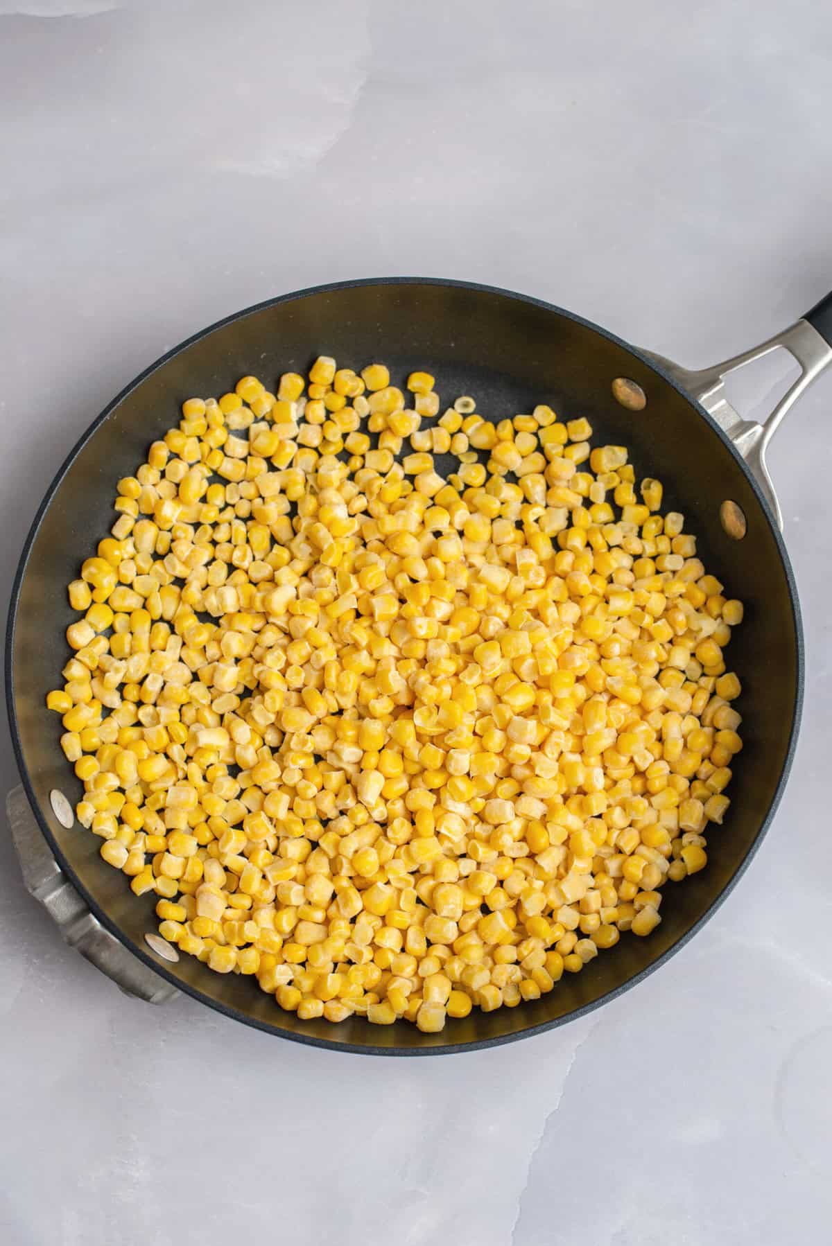 Sauté corn in a skillet