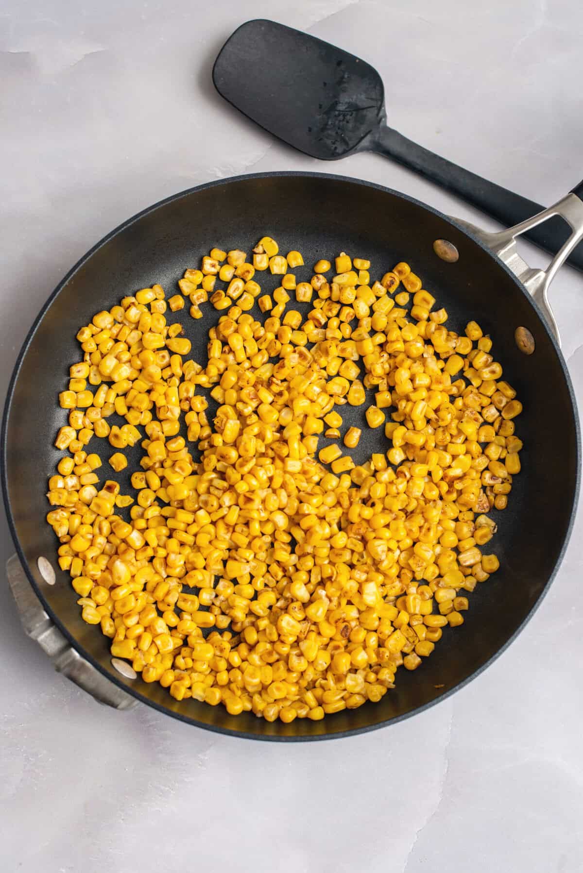 Sauté corn until lightly charred.