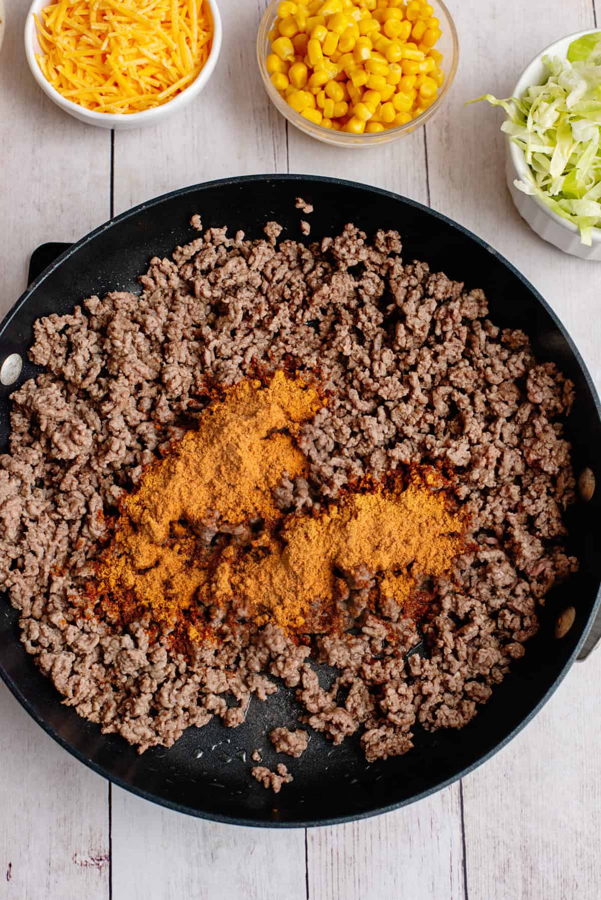 Stir taco seasoning into browned ground beef