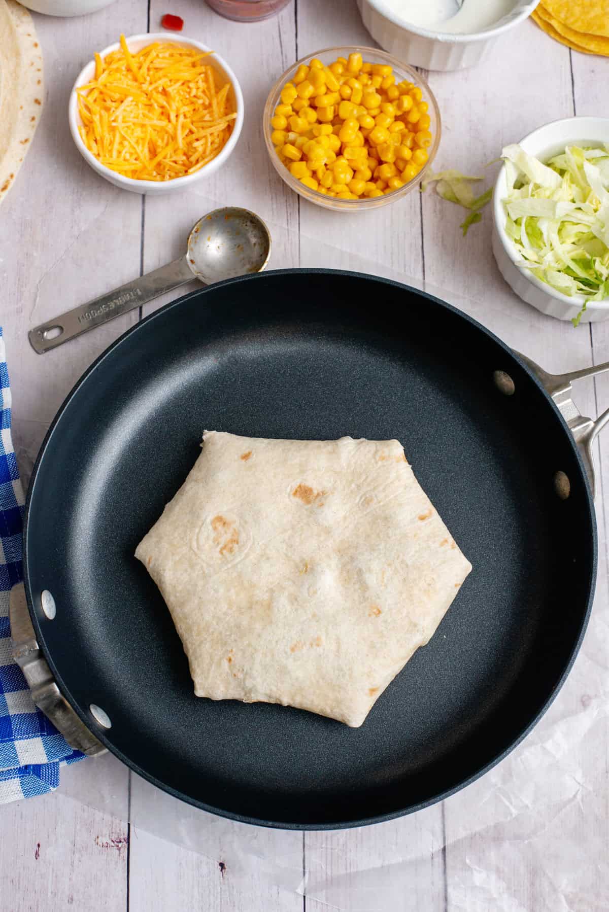 heat skillet and place wrap folded side down