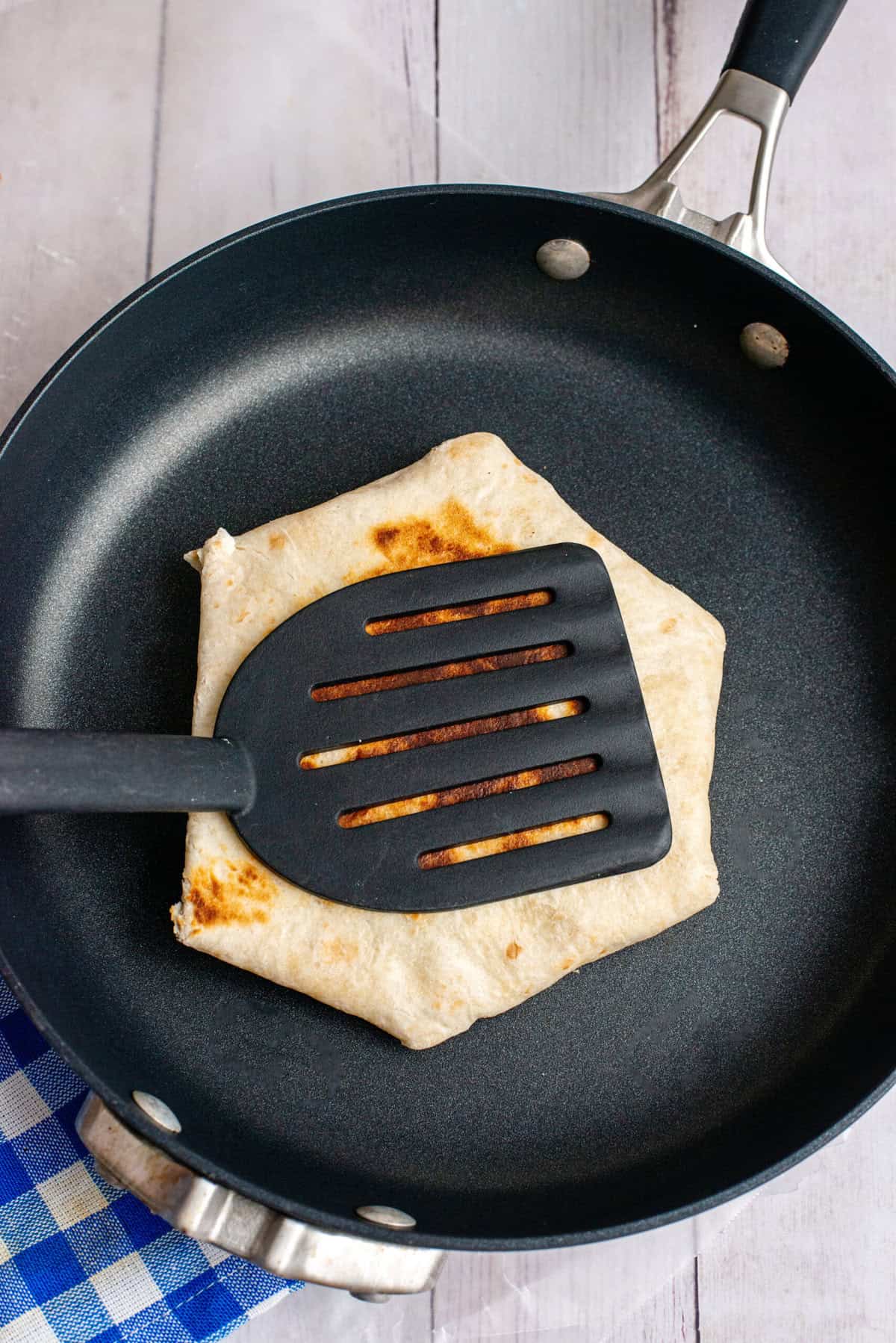 Press down with spatula to make for even browning