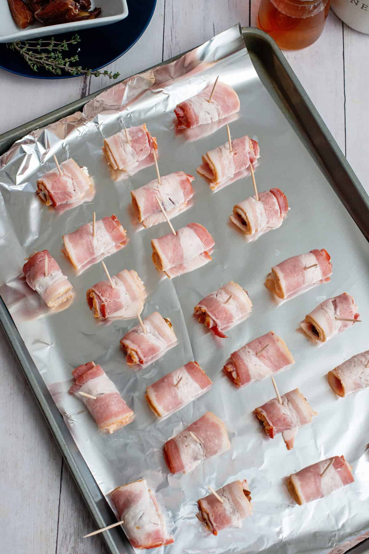 place Bacon Wrapped Dates on prepared baking sheet