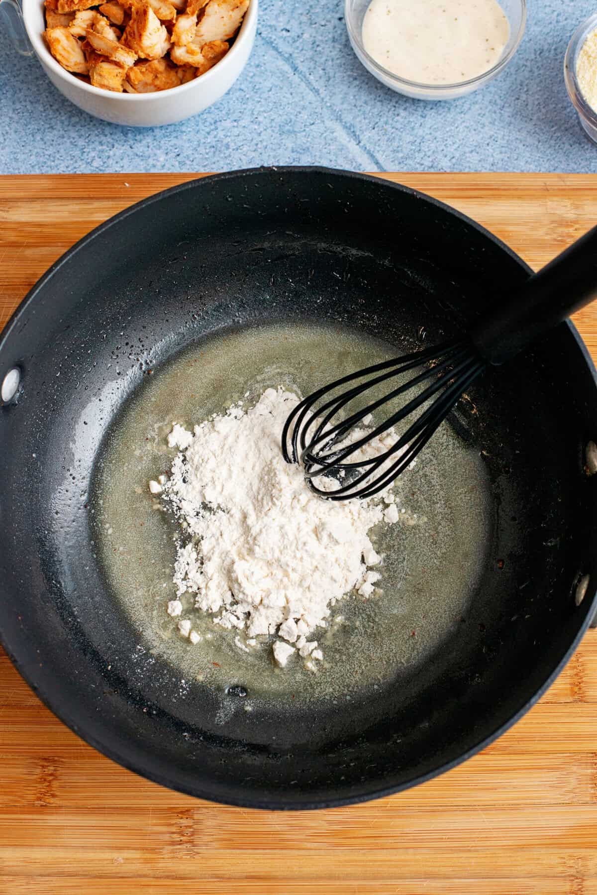 Add flour and whisk to make a roux